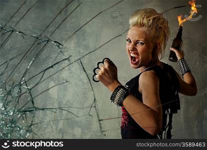 Punk girl behind broken glass
