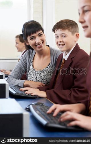 Pupils In Computer Class With Teacher