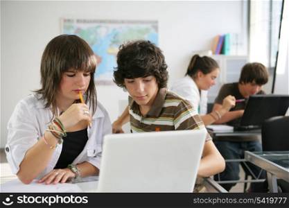 pupils studying in a classroom