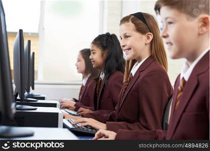 Pupils Wearing School Uniform In Computer Class