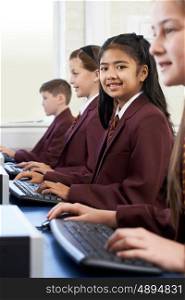 Pupils Wearing School Uniform In Computer Class