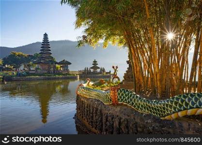 Pura Ulun Danu Bratan Temple at sunrise, a Hindu temple with mountain, lake, in Bali island, Indonesia. Natural landscape background.