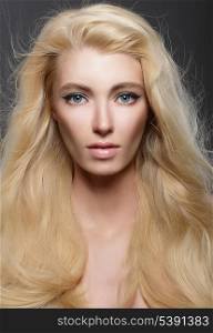 Pure Beauty. Portrait of Young Blonde with Healthy Flowing Hair