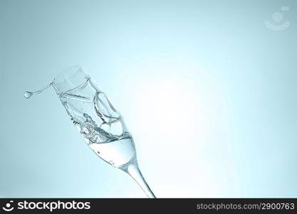 pure water splashing into glass