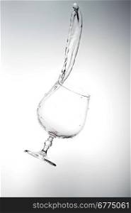 pure water splashing into glass