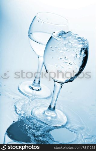 pure water splashing into glasses