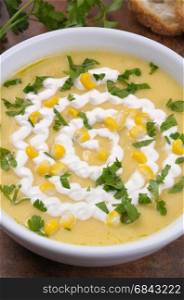 Puree soup mealies seasoned with grains of corn, parsley and sour cream