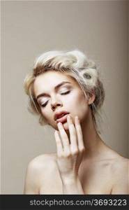 Purity. Sensual Romantic Blond Female with Closed Eyes touching her Face. Muse