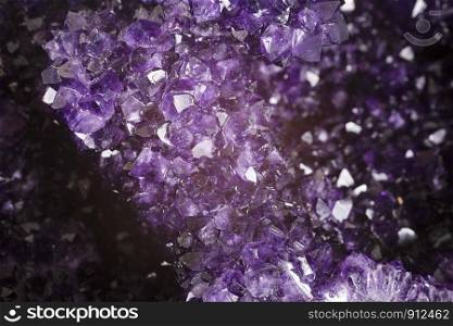 purple amethyst in front of white background