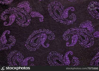 Purple and black floral fabric background