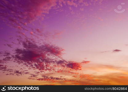 Purple and orange sky with clouds in the dusk