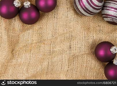 Purple Christmas balls isolated on canvas