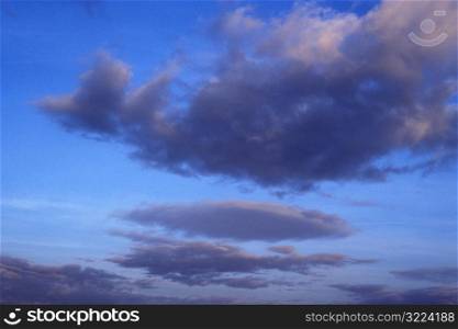 Purple Clouds In A Light Blue Sky