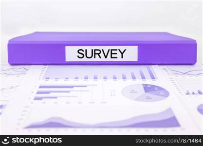 Purple document binder with survey word place on graphs, charts and marketing reports