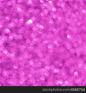 Purple festive glitter background with defocused lights
