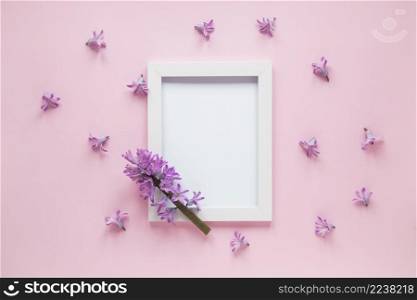 purple flower branch with blank frame table