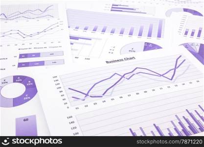 purple graphs, charts, data and report summarizing for marketing research, management budget and planning business project