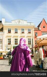 Purple Muslim. Muslim Woman in City centre in Tallin