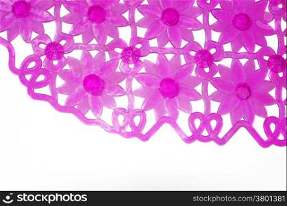 Purple rubber mat for bath with flower pattern as background