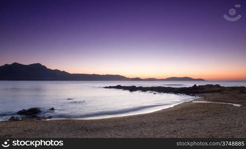 Purple sunset over Calvi and Revellata from Arinella Plage in Corsica