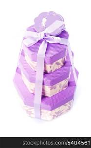 Purple three cute boxes with presents isolated on white