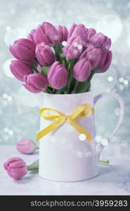 Purple tulip bouquet on blue background