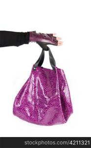 purple women bag at hand isolated on a white background