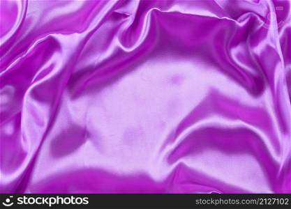 Purple wrinkled cloth background for design in your work concept.