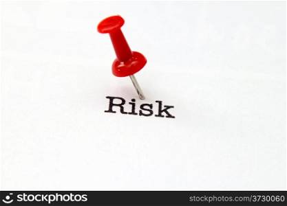 Push pin on risk text