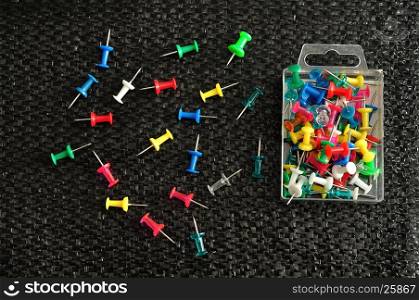 Push pins in a container