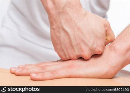 pushing against sports massage, masseur's hands closeup