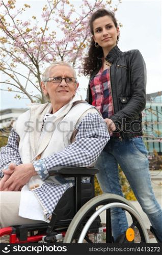 Pushing grandma in wheelchair