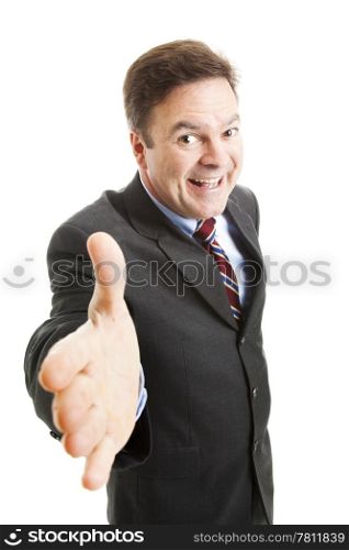 Pushy salesman with an oversized grin, coming in for a handshake. Isolated on white.