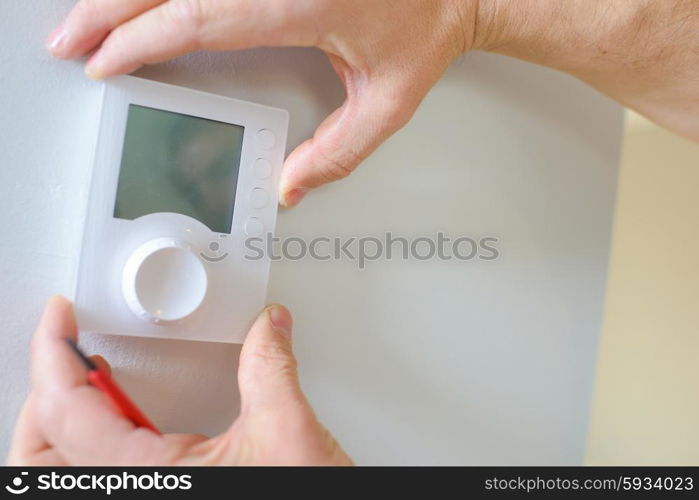 Putting in place a thermostat control panel