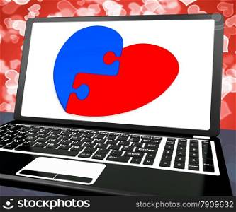 . Puzzle Heart On Laptop Shows Engagement And Marriage