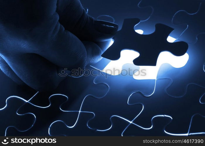 Puzzle pieces. puzzle piece coming down into its place