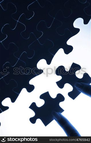 Puzzle pieces. puzzle piece coming down into its place