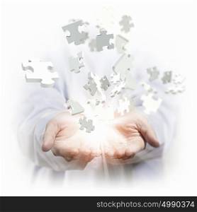puzzle pieces. White multiple puzzle piece flying in different directions