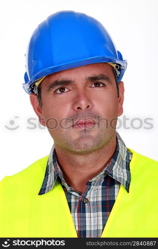Puzzled construction worker