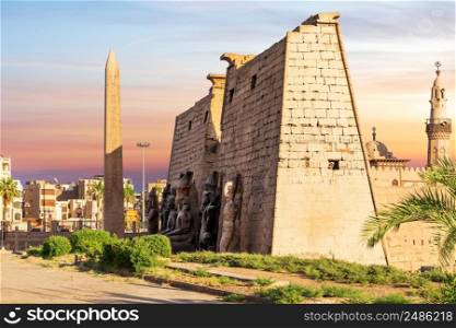 Pylon with obelisk in Luxor Temple, beautiful sunset view, Egypt.. Pylon with obelisk in Luxor Temple, beautiful sunset view, Egypt