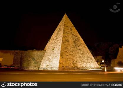 Pyramid lit up at night, Pyramid of Cestius, Rome, Italy