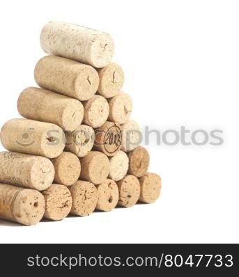 Pyramid made of used Wine corks isolated on white