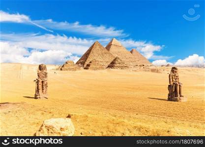 Pyramids of Egypt and The Colossi of Memnon in the desert of Giza.. Pyramids of Egypt and the Colossi of Memnon in the desert of Giza