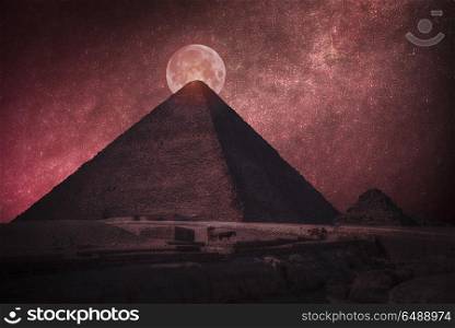 pyramids of Egypt. At night the bloody moon and stars shine. night the bloody moon and stars shine