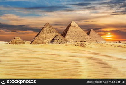 Pyramids of Egypt at sunset, famous Wonder of the World, Giza.