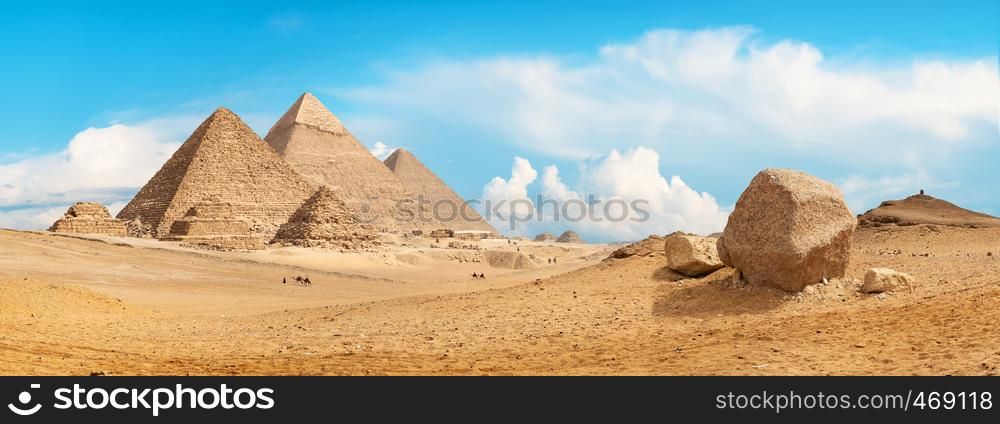 Pyramids of Giza in the desert by day