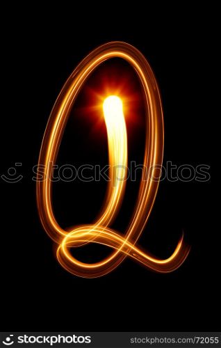 Q - Created by light alphabet over black background