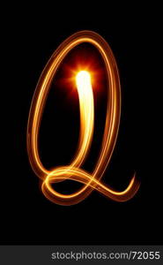 Q - Created by light alphabet over black background