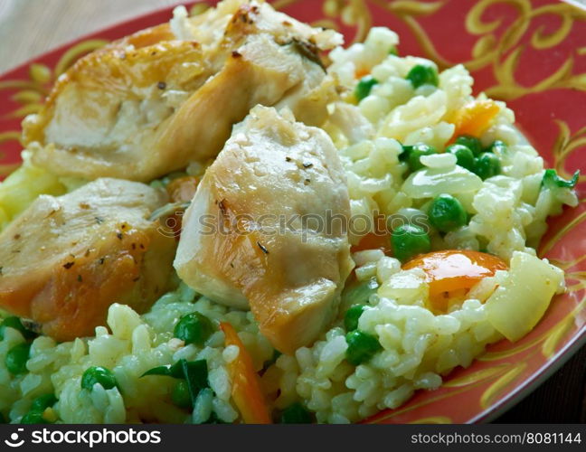 Qatami Brinjit fried chicken with rice and vegetables. Georgian cuisine