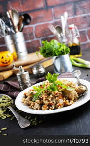 qinoa porridge with vegetables on white plate